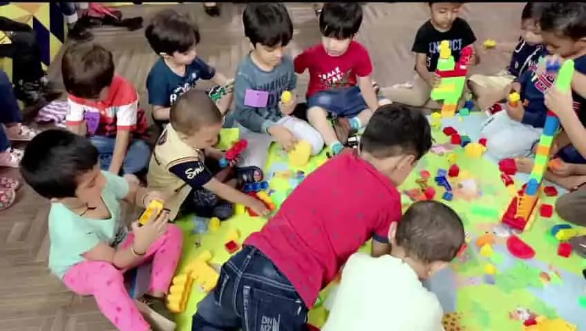 Children building with colourful blocks