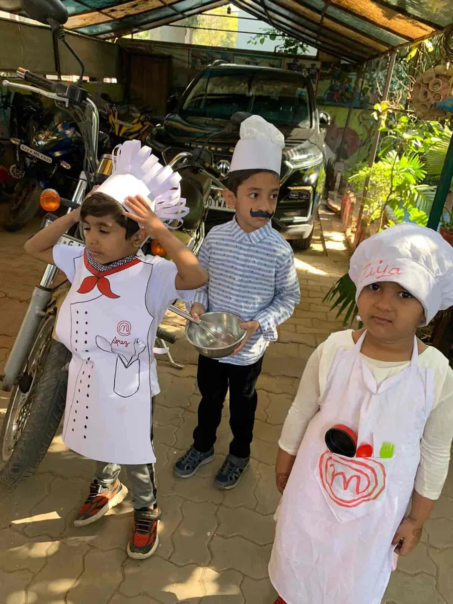 Little chefs with play cooking tools