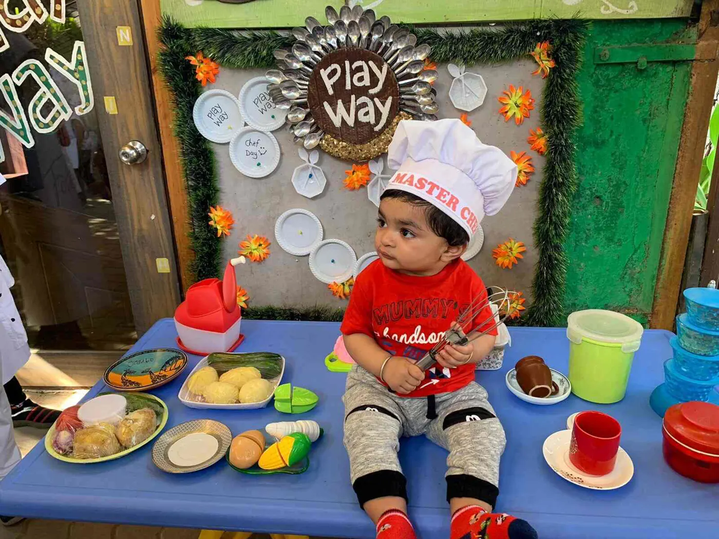 A little chef with play food on Masterchef Junior day
