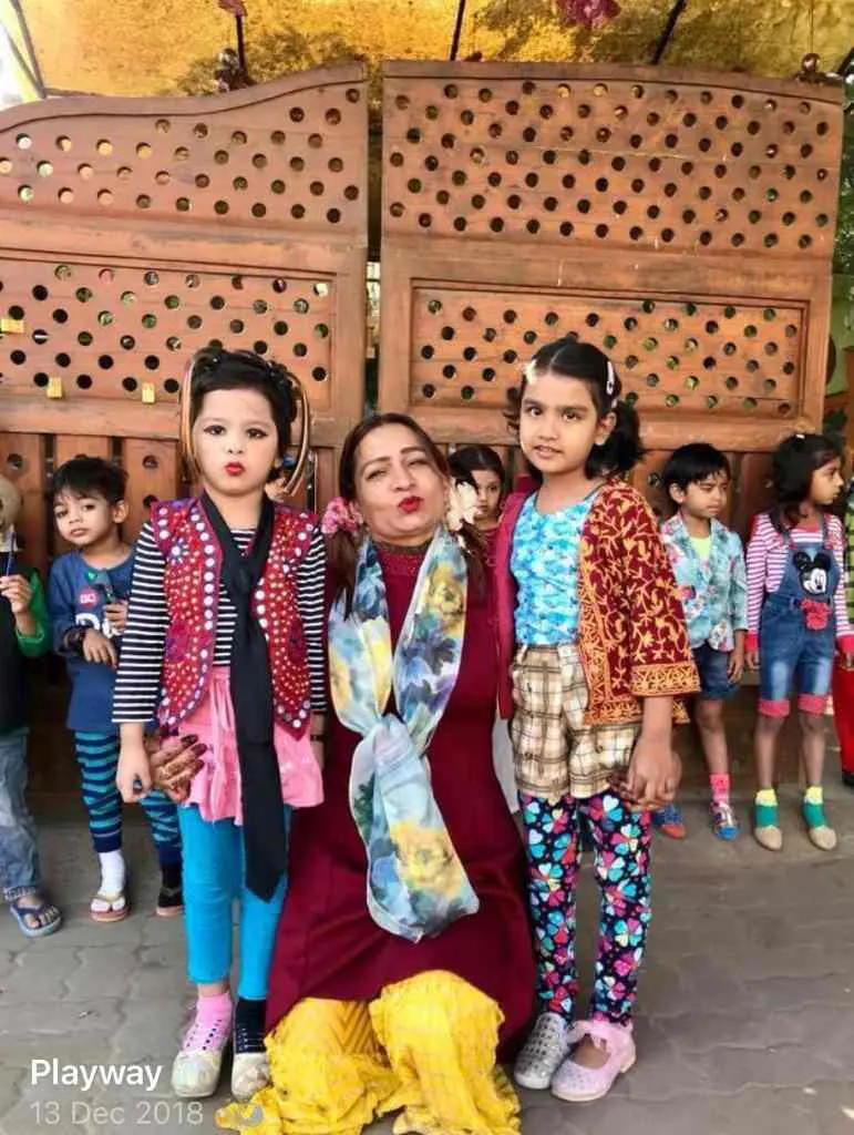 Teacher with children in fancy dress